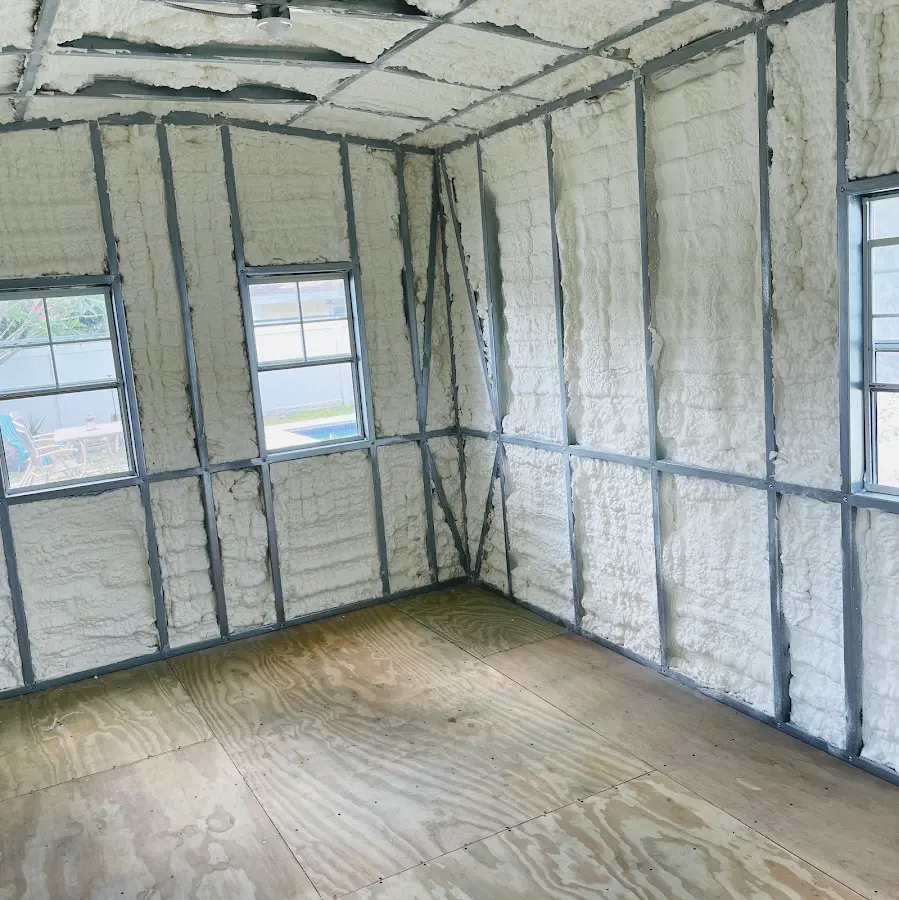 Closed-cell spray foam insulation applied to wall cavities in a residential project in Wood Dale
